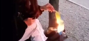 Под смех друзей: в Каменском девушка сожгла украинский флаг (обновлено)